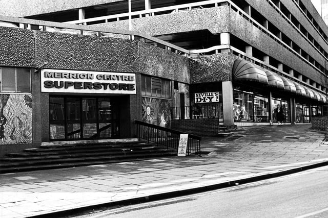 The Merrion Centre from Merrion Way in February 1985. On the left is the Merrion Centre Superstore, an indoor retail market. To the right of this is Nevilles D-I-Y.