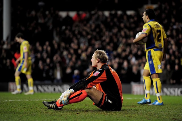 Leeds United goalkeeper Casper Ankergren looks dejected after Peter Crouch scored the opening goal of the game.