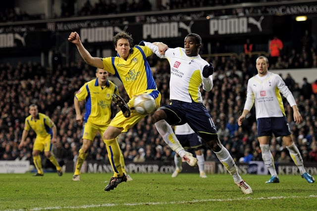 Leigh Bromby flicks the ball past Tottenham Hotspur's Sebastien Bassong for Jermaine Beckford to latch on to.