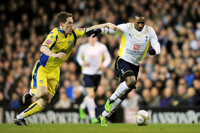 Neil Kilkenny challenges Tottenham Hotspur striker Jermain Defoe.
