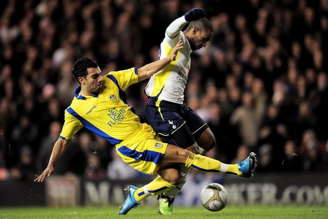 Jason Crowe tackles Tottenham Hotspur striker Jermain Defoe.