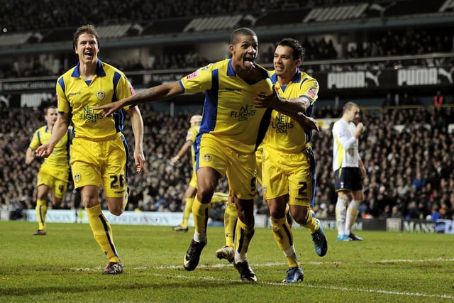 Jermaine Beckford celebrates his equaliser with teammates Leigh Bromby (left) and Jason Crowe (right).
