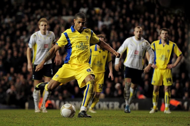 Jermaine Beckford scores from the penalty spot to level the scores 2-2 deep into injury time.