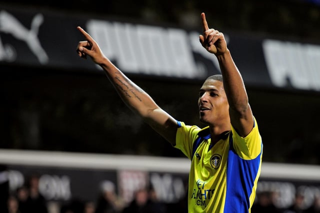 Jermaine Beckford celebrates with the travelling faithful after levelling from the penalty spot deep into injury time.