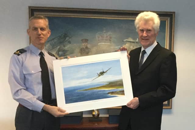 Artist Denis Harry Fox with Air Chief Marshal of the Royal Air Force Sir Stephen John Hillier KCB, CBE, DFC, ADC at a presentation ceremony in 2019.