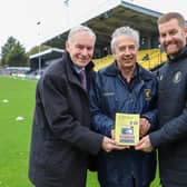 Book launch - Harrogate Town photographer Matt Kirkham's picture of Harrogate Town historian Phil Harrison, centre, with the club's chairman Irving Weaver and manager Simon Weaver at the EnviroVent Stadium.