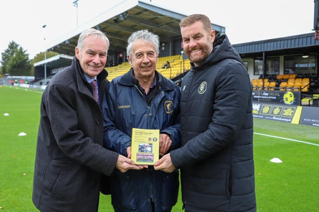 Book launch - Harrogate Town photographer Matt Kirkham's picture of Harrogate Town historian Phil Harrison, centre, with the club's chairman Irving Weaver and manager Simon Weaver at the EnviroVent Stadium.