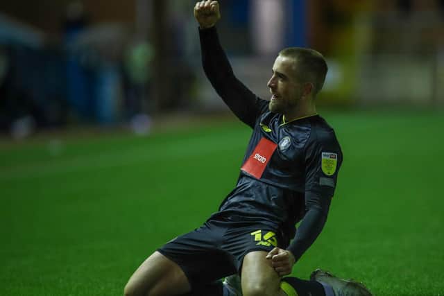 Alex Pattison celebrates after putting Harrogate Town 2-0 up against Carlisle United.