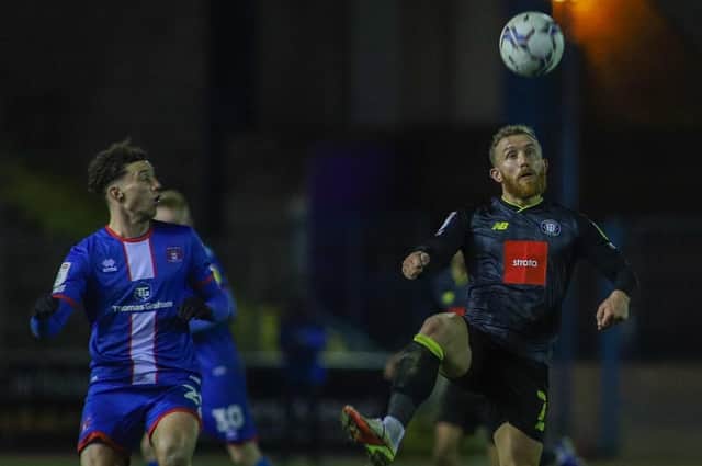 George Thomson in action during Harrogate Town's 2-0 success at Carlisle United. Picture: Matt Kirkham