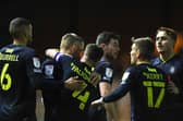 Harrogate Town players celebrate their second goal in Tuesday evening's 2-0 win t Carlisle United. Pictures: Matt Kirkham