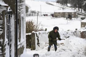 Villagers dig their way out. Picture Gerard Binks