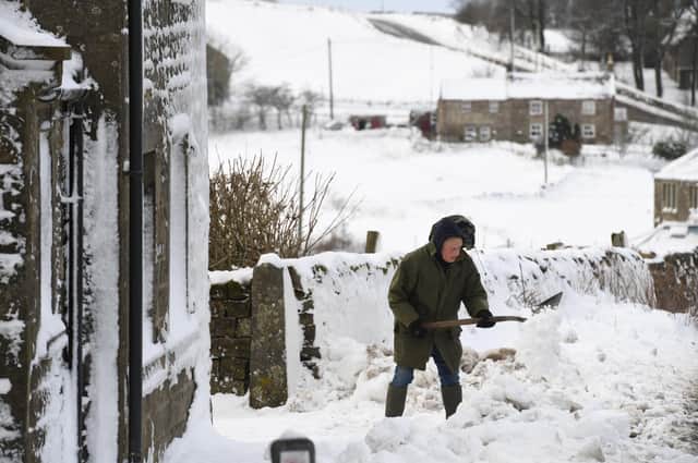 Villagers dig their way out. Picture Gerard Binks