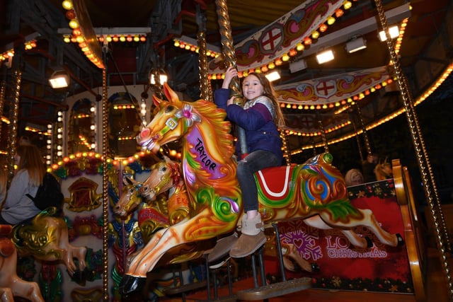 Imogen Mercer (aged 5) on the carousel down at Crescent Gardens