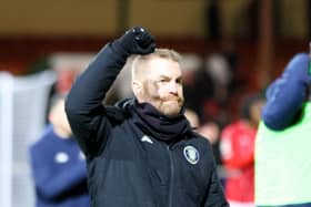 Simon Weaver salutes Harrogate Town's travelling supporters following Saturday's 1-1 draw at Swindon Town. Pictures: Matt Kirkham