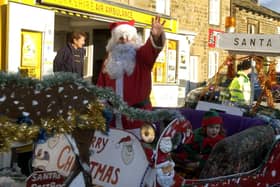 Father Christmas is pulled round the Market Place at Masham Victorian Fair.
