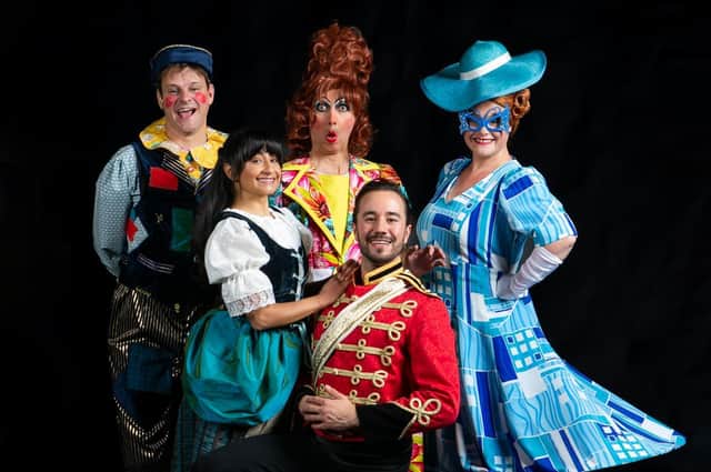 The cast of Harrogate Theatre's Cinderella whose performance was rapturously received on Friday night before the storm hit. Now the show is back on.