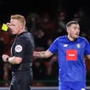 Harrogate Town left-back Lewis Page cannot hide his belief after being booked by referee Alan Young during the second half of Saturday's 1-1 League Two draw at Swindon Town. Pictures: Matt Kirkham