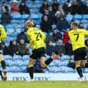 Luke Armstrong, centre, runs away to celebrate after firing Harrogate Town into the lead against Portsmouth. Pictures: Matt Kirkham