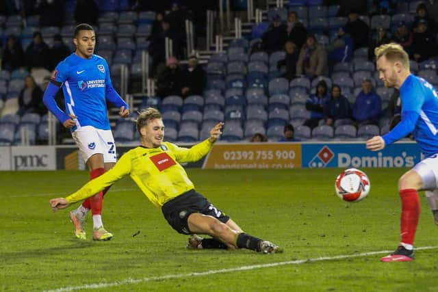 Jack Diamond stretches to net Town's stoppage-time winner at Fratton Park.