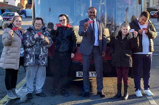 The Harrogate Bus Company's General Manager Steve Ottley and studetns from the Personalised Learning College in Starbeck with their travel passes