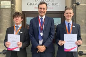 Headteacher of Harrogate Grammar School Neil Renton with Harry Bearne (left) and Matthew MacDermott (right)