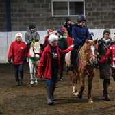Stockeld Riding for the Disabled group enjoy a visit from Father Christmas. Picture: Jonathan Gawthorpe.
