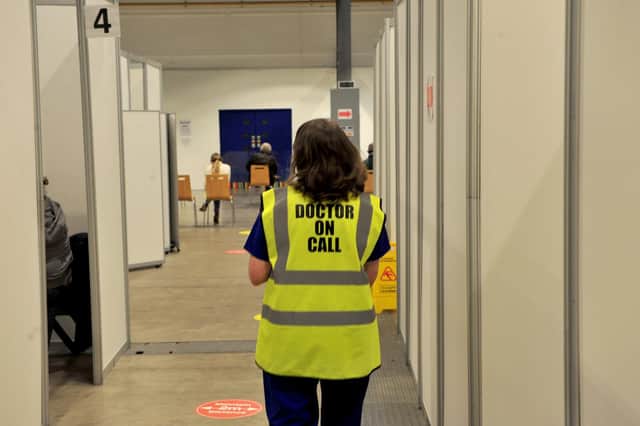 The push to get a booster jab - A doctor at Harrogate Vaccination Centre feature. (Picture Gerard Binks)