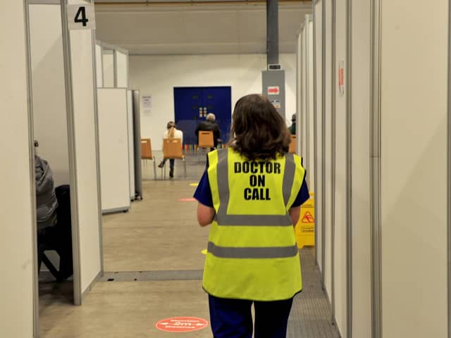 The push to get a booster jab - A doctor at Harrogate Vaccination Centre feature. (Picture Gerard Binks)