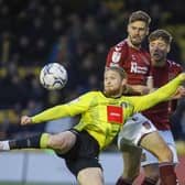 Harrogate Town striker Luke Armstrong takes aim at the Northampton Town goal. Pictures: Matt Kirkham