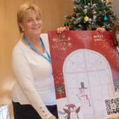 Helen Suckling, Partnership and Commercial Manager at Visit Harrogate, student Molly Hall and Mrs Acheson, Headteacher at Grewelthorpe C of E Primary School, celebrate Molly’s winning window design which is now on display at Ripon Library