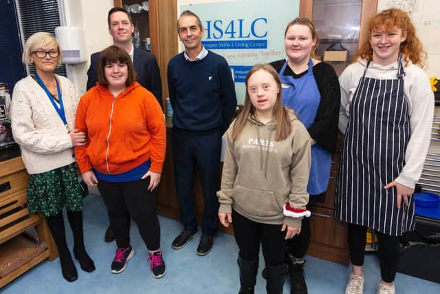 Ben Cooper, representative of local connectivity provider TalkTalk, joins staff at the Harrogate Skills 4 Living Centre to celebrate the donation