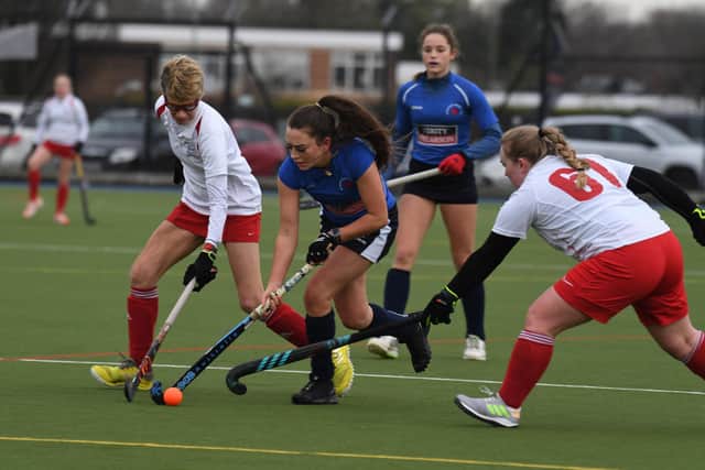 Hannah Nash weaves her way past a couple of Halifax defenders.