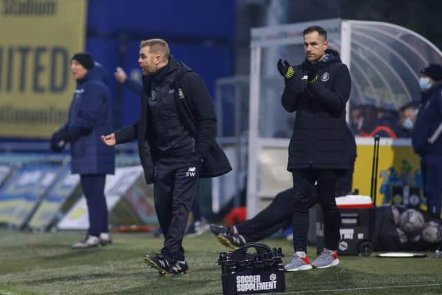 Harrogate Town boss Simon Weaver and his assistant, Paul Thirlwell, urge their troops on from their technical area.