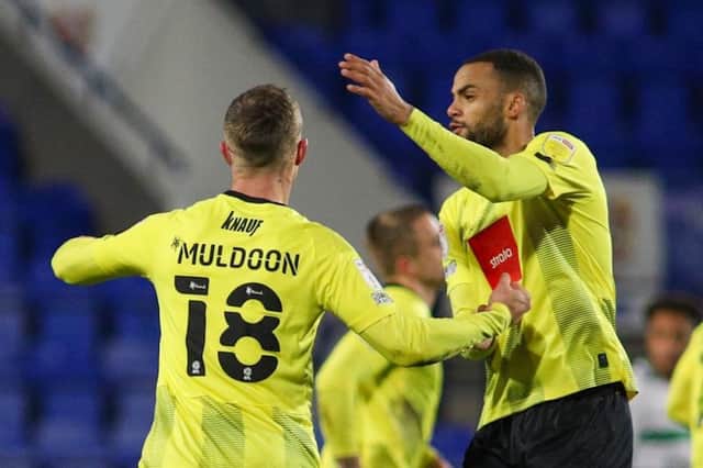Jack Muldoon is congratulated by team-mate Warren Burrell after drawing Harrogate Town level in the 54th minute of Tuesday's EFL Trophy clash with Tranmere Rovers. Pictures: Matt Kirkham