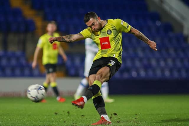 Harrogate Town left-back Lewis Page takes aim at the Tranmere Rovers goal during Tuesday evening’s EFL Trophy clash at Prenton Park. Pictures: Matt Kirkham