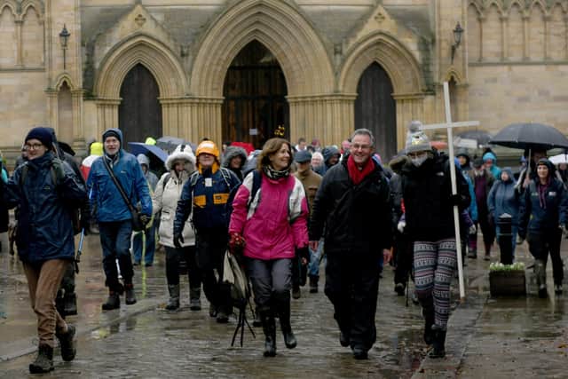 The Dean of Ripon Cathedral  John Dobson  (centre)  leads the annual Boxing  day pilgrimage from the cathedral to Fountains Abbey