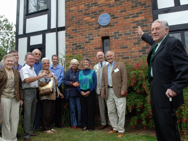 Robert Elleray and members of the Worthing Society with the blue plaque at the house in Lansdowne Close, Worthing, where Henfrey Smail lived from 1930 to 1979.