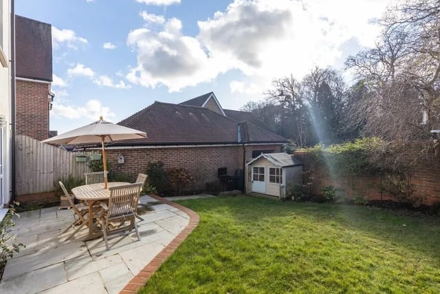 South west facing, the garden benefits from plenty of daylight sun and backs onto part of the woodland of Bolnore. The patio has been extended to create more entertaining space. Picture: Move Revolution.