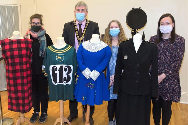 Rachel Archibald, Jamie Austin and Sarah Carson from Causeway Coast and Glens Borough Council’s Museums Service and the Mayor, Councillor Richard Holmes, view some of the fashion and costume items on display in the ‘100 Objects for 100 Years’ exhibition currently open at Ballymoney Museum