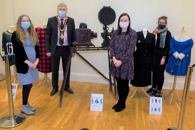 Rachel Archibald, Jamie Austin and Sarah Carson from Causeway Coast and Glens Borough Council’s Museums Service and the Mayor, Councillor Richard Holmes, with some of the items on display in the ‘100 Objects for 100 Years’ exhibition which is now open at Ballymoney Museum