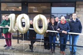 The support team at Harrogate charity Lifeline mark the 100th homeless person they have given accomodation to.