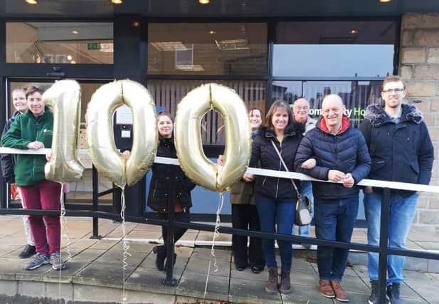 The support team at Harrogate charity Lifeline mark the 100th homeless person they have given accomodation to.