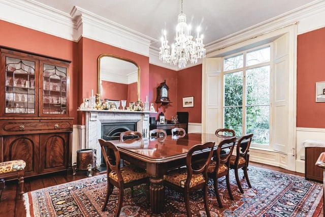 The drawing room has a bright bay window sits adjacent to the formal dining room.