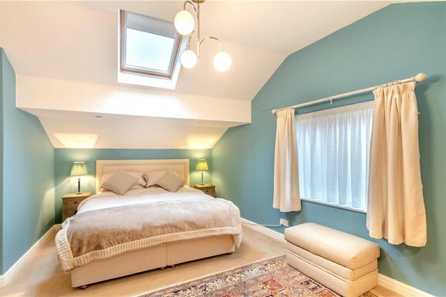 A stylish double bedroom with skylight.