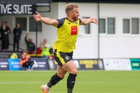 George Thomson celebrates after firing Harrogate Town into a two-goal lead against Morecambe. Pictures: Matt Kirkham