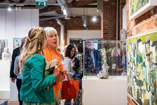 End of an era - Crowds at one of the many successful New Light exhibitions presented by small but groundbreaking New Light arts charity. (Picture contributed)