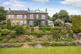 A view of the property with its tiered gardens.