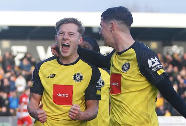 James Daly, left, celebrates after putting Harrogate Town 2-1 up against Doncaster Rovers. Pictures: Paul Thompson/ProSportsImages