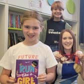 North Yorkshire-based Paralympian and author Danielle Brown with her gold medals and an honorary Ready, Set, Read medal.  Beth Kent, 12, and Emily Scott, 16, with Summer Reading Challenge participant Lucy Browne, seven, who holds Danielle's book, Run Like a Girl.