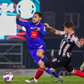 Levi Sutton in action for Harrogate Town during Tuesday night's 0-0 draw with Grimsby Town at Blundell Park. Pictures: Matt Kirkham